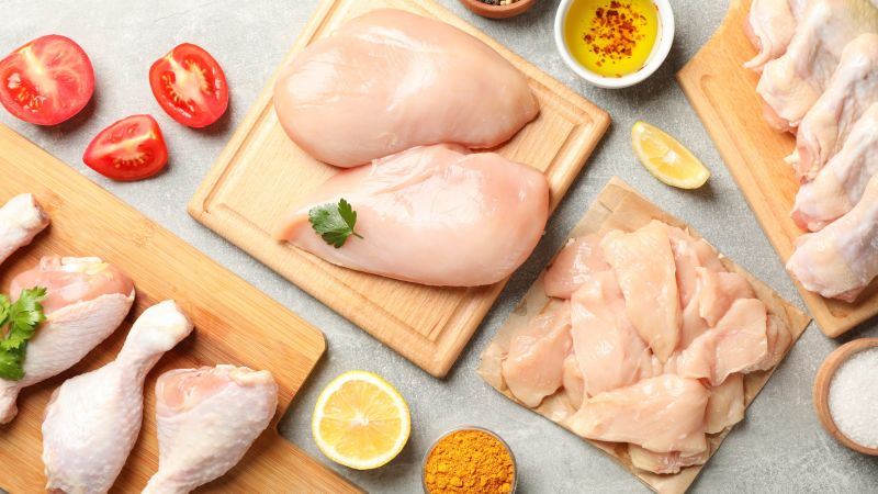 Composition with raw chicken meat on gray background, top view. Cooking chicken
